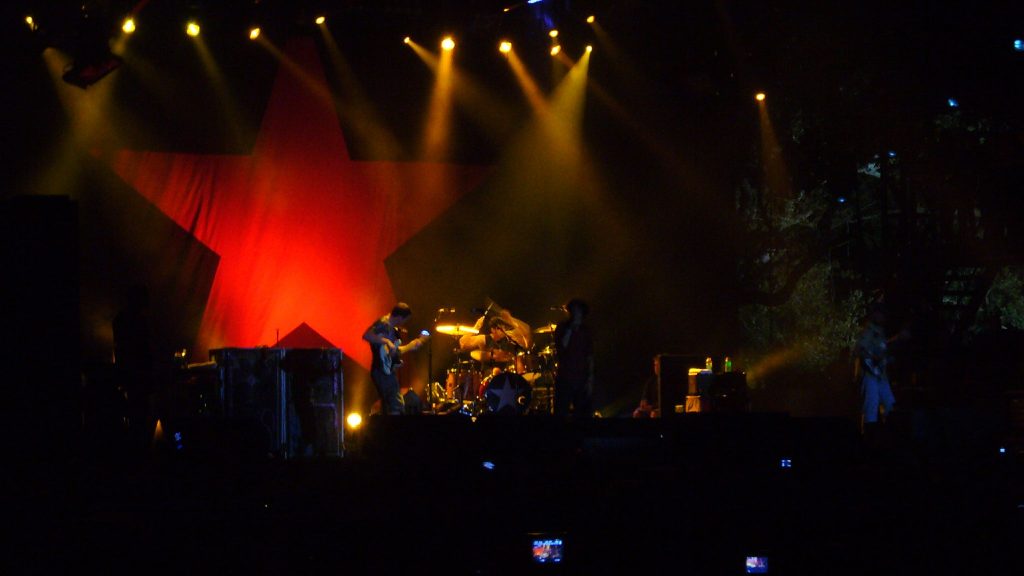 Rage Against The Machine performing with a Zapatista flag